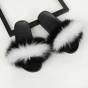 Black and white fox fur slides